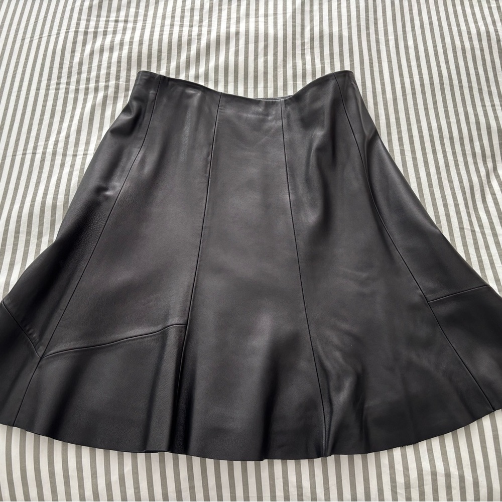 Antonio Melani black leather A-line skirt, knee-length, fully lined, medium.